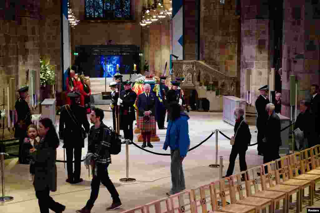 King Charles III and other members of the royal family hold a vigil at St. Giles' Cathedral, Edinburgh, in honor of Queen Elizabeth II as members of the public walk past, Sept. 12, 2022.