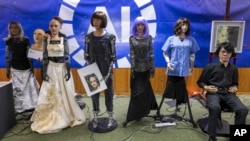 Robots at a news conference with a panel of AI-enabled humanoid social robots as part of ITU's 'AI for Good' global summit in Geneva, Switzerland, July 07, 2023.