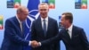 Turkey's President Recep Tayyip Erdogan, left, shakes hands with Sweden's Prime Minister Ulf Kristersson, right, as NATO Secretary General Jens Stoltenberg looks on prior to a meeting ahead of a NATO summit in Vilnius, Lithuania, July 10, 2023.