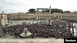 People attend the Angelus prayer led by Pope Francis from his window, at the Vatican, Nov. 12, 2023. (Vatican Media/­Handout via Reuters) 
