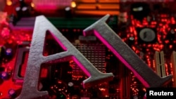FILE - AI (Artificial Intelligence) letters are placed on computer motherboard in this illustration taken, June 23, 2023.