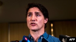Canadian Prime Minister Justin Trudeau speaks at the emergency response center at the Expo Center on Aug. 18, 2023, in Edmonton, Alberta, set up to help residents forced to evacuate Yellowknife, Northwest Territories, Canada, due to wildfires.