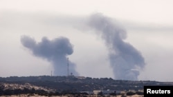 Smoke rises over Gaza, as seen from Israel's maritime border with Gaza in southern Israel, Oct. 27, 2023. 