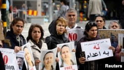 FILE - A demonstration supporting the Swedish-Iranian doctor and researcher Ahmadreza Djalali, who is imprisoned and sentenced to death in Iran, was held in Stockholm, May 14, 2022.