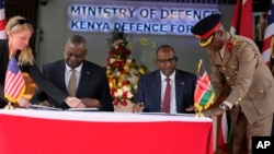 U.S. Defense Secretary Lloyd J. Austin, left and Kenya's Cabinet Secretary for Defense Aden Duale, sign a bilateral defense cooperation agreement in Nairobi, Kenya, Sept. 25, 2023. 