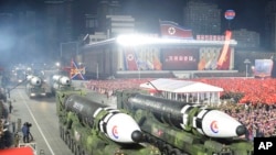 This photo provided by the North Korean government, shows what it says is Hwasong-17 intercontinental ballistic missiles during a military parade in Pyongyang, North Korea, Feb. 8, 2023. 