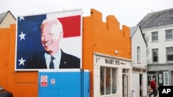 A mural of President Joe Biden adorns the side of a shop in Ballina, Ireland, April, 4, 2023. Biden is to visit the town next week, part of a trip to Ireland and Northern Ireland.