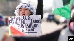 FILE - Amana Ali protests Israel's attacks in Gaza, on Feb. 8, 2024 in Dearborn, Michigan. President Joe Biden is meeting with American Muslim community leaders on Tuesday amid outrage from Muslim and Arab Americans over his support for Israel's war against Hamas in Gaza. 