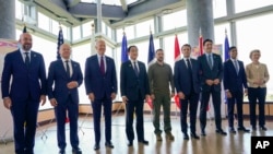 Ukrainian President Volodymyr Zelenskyy, center, meets with G-7 leaders before a session about Ukraine during the G-7 Summit in Hiroshima, Japan, May 21, 2023.