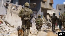 This handout picture released by the Israeli army on May 18, 2024, shows Israeli soldiers during military operations in the Gaza Strip.