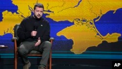 Ukrainian President Volodymyr Zelenskyy speaks during his end-of-the-year news conference in Kyiv, Ukraine, Dec. 19, 2023.