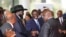 FILE - South Sudanese President Salva Kiir Mayardit, left, shakes hands with Pagan Amum Okiech of the Real-SPLM group during peace talks in Nairobi, Kenya, on May 9, 2024. 
