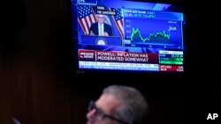 A news conference by Federal Reserve Chairman Jerome Powell is displayed on the floor at the New York Stock Exchange in New York, May 3, 2023. 