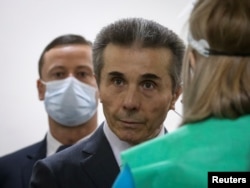 FILE - Bidzina Ivanishvili, Georgia's former Prime Minister, stands at a polling station during a municipal election in Tbilisi, Georgia, Oct. 2, 2021.