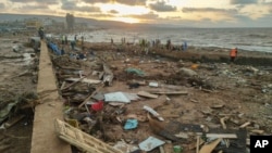 Rescuers and relatives search for bodies of the flood victims in Derna, Libya, Sept. 15, 2023.