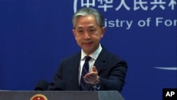 FILE - In this image from video, Chinese Foreign Ministry spokesperson Wang Wenbin speaks during a media briefing at the ministry in Beijing, Feb. 13, 2023.