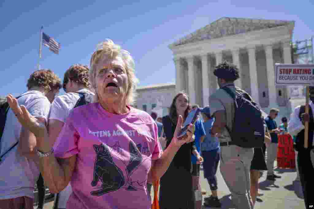 Celeste McCall of Washington reacts in confusion outside the Supreme Court in Washington after decisions were announced. "I'm confused I was told [Trump] has no immunity for unofficial acts," said McCall. "I don't even know what that means. I'm beyond confused."&nbsp;