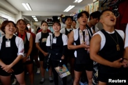 Tokyo Rikchsaw pullers attend a morning meeting at the office in the Asakusa district, Tokyo, Japan, June 18, 2023. (REUTERS/Issei Kato)