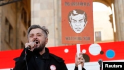 FILE - Nika Gvaramia, chief executive officer of Rustavi 2, speaks during a rally to support opposition TV channel Rustavi 2 in Tbilisi, Georgia, Feb. 19, 2017. 