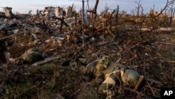 FILE - The bodies of dead Russian soldiers lie at the front line in Andriivka, in Ukraine's Donetsk region, Sept. 16, 2023.