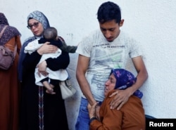 A woman mourns the loss of Palestinians killed in Israeli strikes, amid the conflict between Israel and the Palestinian Islamist group Hamas, in Rafah, in the southern Gaza Strip, May 8, 2024.