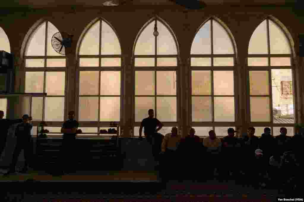 Men attend prayers during the funeral of Ahmad Ghaleb, 16, in Qalandia Refugee Camp, Oct. 25, 2023.