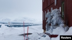 FILE - Lion statues decorate the entrance of the China's Yellow River scientific station in Ny-Aalesund, Svalbard, Norway, April 6, 2023. 