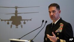 FILE - U.S. Navy Vice Adm. Brad Cooper, who heads the Navy's Bahrain-based 5th Fleet, speaks at an event at the International Defense Exhibition and Conference in Abu Dhabi, United Arab Emirates, Feb. 21, 2023. 