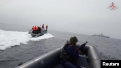 Participants sail boats during a joint Russian-Chinese naval exercise in the waters of the Sea of Japan, in this still image taken from video released by the Russian Defense Ministry July 20, 2023.