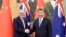 In this photo released by Xinhua News Agency, Australia's Prime Minister Anthony Albanese, left, meets with China's President Xi Jinping at the Great Hall of the People in Beijing, Nov. 6, 2023. (Ding Haitao/Xinhua via AP)