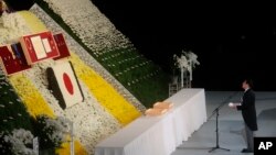 Prime Minister of Japan Fumio Kishida stands at the altar during former Prime Minister Shinzo Abe's state funeral, Tuesday, Sept. 27, 2022, in Tokyo. Abe was assassinated in July. (Leah Millis/Pool Photo via AP)