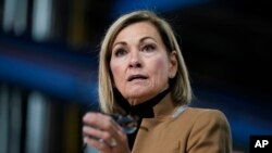 Congress FILE - Iowa Gov. Kim Reynolds speaks during a news conference at Iowa Spring Manufacturing, Wednesday, Oct. 20, 2021.