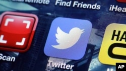 FILE - A Twitter app on an iPhone screen is shown.