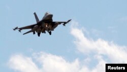 FILE - A Turkish F-16 fighter jet approaches Incirlik Air Base in Adana, Turkey, July 3, 2012.