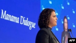 FILE - Najla Mangoush, Libya's Minister of Foreign Affairs, speaks during the 17th IISS Manama Dialogue in the Bahraini capital Manama, Nov. 20, 2021.