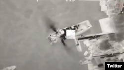 A screen grab from video published May 7, 2022, on the Twitter feed of Ukraine's defense ministry purports to show a Russian ship shortly before it was hit from a Ukrainian Bayraktar TB2 drone. 