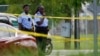 Investigators search the crime scene of a shooting at Xavier University in New Orleans, May 31, 2022. 