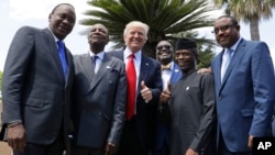 President Trump poses with, from left, Kenyan President Uhuru Kenyatta, African Union President Alpha Conde', African Development Bank President Akinwumi Adesina, Nigerian Vice President Yemi Osinbajo, and Ethiopian PM Haile Mariam Desalegn, in Taormina, Italy.