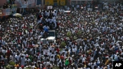 Protesters led by the art community demand the resignation of Haitian President Jovenel Moise as they march through Port-au-Prince, Haiti, Oct. 13, 2019.
