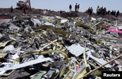 FILE - Wreckage is seen at the site of the Ethiopian Airlines plane crash, southeast of Addis Ababa, Ethiopia, March 11, 2019.