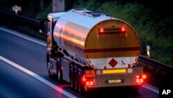 FILE - A fuel trucks drives along a highway in Frankfurt, Germany, Jan. 27, 2023. European Union governments have agreed to place an embargo on Russian diesel which comes into effect Sunday.