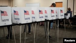 People cast their ballots early for the upcoming midterm elections in Las Cruces, N.M., U.S., Oct. 24, 2022.