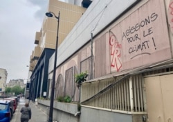 Graffiti near the Place de la Bastille in Paris calling for climate action. (Lisa Bryant/VOA)