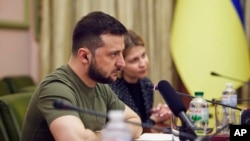 In this photo provided by the Ukrainian Presidential Press Office, Ukrainian President Volodymyr Zelenskyy listens during his meeting with President of the European Parliament Roberta Metsola in Kyiv, Ukraine, April 1, 2022.