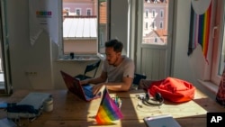 SPoD LGBTQ association lobbyist Ogulcan Yediveren works in his office in Istanbul, Sept. 19, 2022.