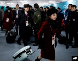 Members of the North Korean Olympic delegation arrive at the Olympic Village of the 2018 Winter Olympics in Gangneung, South Korea, Feb. 1, 2018.