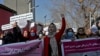 Afghan women shout slogans during a rally to protest against what the protesters say is Taliban restrictions on women, in Kabul, Afghanistan, Dec. 28, 2021. 