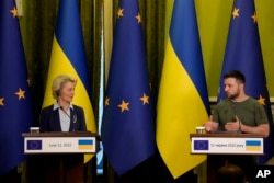 In this file photo, Ukrainian President Volodymyr Zelenskyy speaks during a joint press conference with European Commission President Ursula von der Leyen, left, in Kyiv, Ukraine, Saturday, June 11, 2022. (AP Photo/Natacha Pisarenko, Filw)