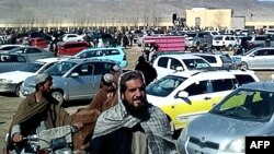 FILE - This screen grab from a video taken on Feb. 22, 2024, shows Afghan men leaving a football stadium after attending the public execution by Taliban authorities of two men convicted of murder, in Ghazni. On Feb. 26, 2024, an execution took place in Sheberghan.
