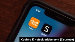安装在一部iPhone手机上Temu和Shein应用程序。(资料图)